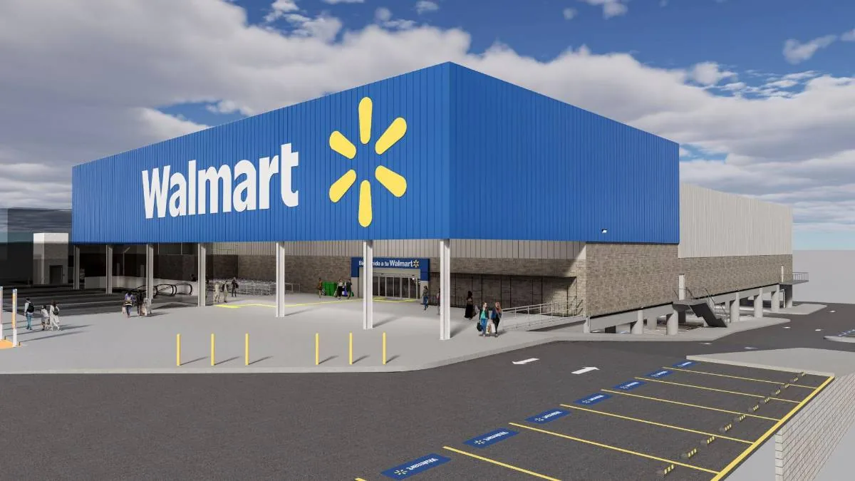 Vista exterior de una tienda Walmart moderna con su distintivo logo azul y amarillo. Clientes entran y salen, con un amplio estacionamiento.