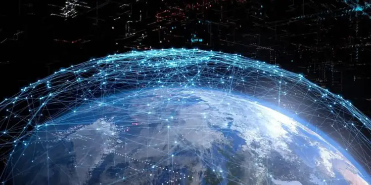Representación digital del planeta Tierra con una red luminosa azul de puntos y líneas que simboliza la conectividad global y el flujo de datos.
