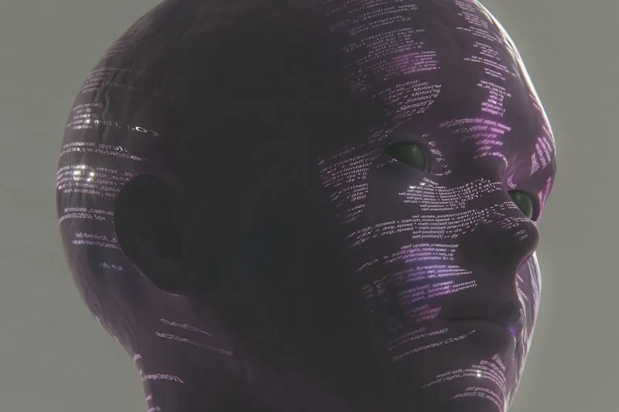 Primer plano de una cabeza de maniquí o figura digital de color morado oscuro, con líneas de código de programación proyectadas sobre su superficie. Los ojos son de un tono verde oscuro. La imagen evoca temas de inteligencia artificial y tecnología.