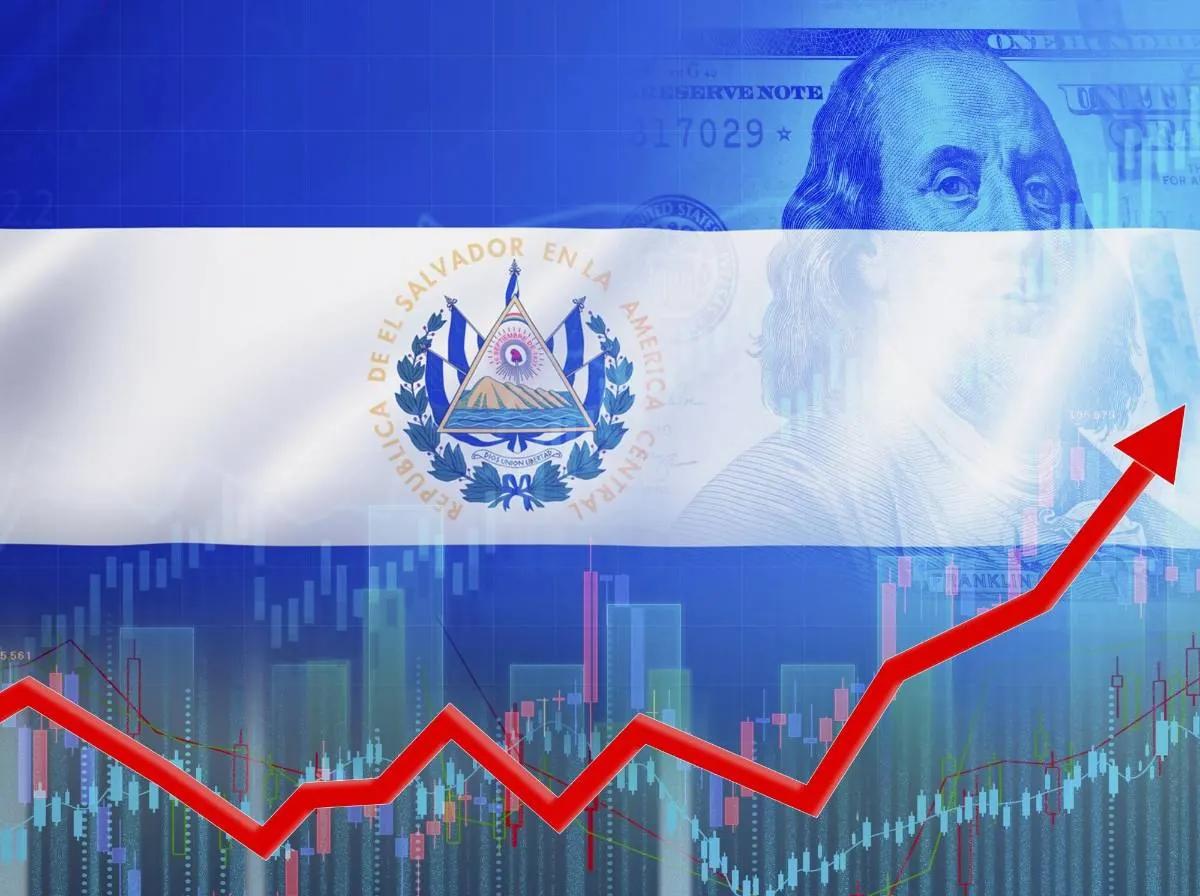 Bandera superpuesta con billetes de dólar y gráficos financieros con una flecha roja alcista en la parte inferior.